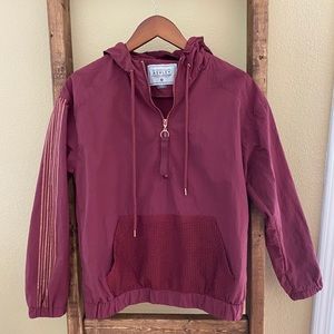 Burgundy Zipper hoodie with mesh pocket and gold stripes.